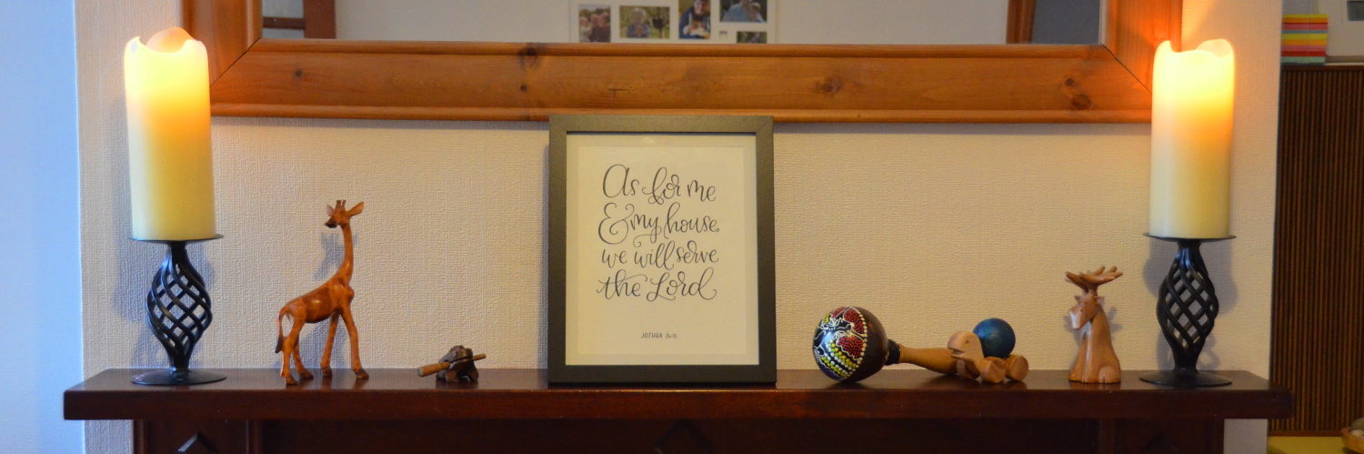 Mantelpiece with a bible verse of "as for me and my house, we will serve the Lord"